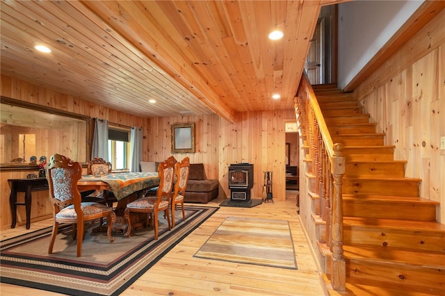 734 Post Rd, Franklin, NY 13775 - dining area with stairs, light wood finished floors, a wood stove, wooden walls, and recessed lighting