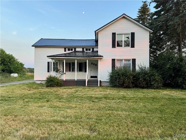 3564 Swartout Rd, Owasco, NY 13021 - view of front facade with a porch, a front lawn, and a metal roof