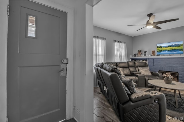 245 Tacoma Ave, Buffalo, NY 14216 - living room with a ceiling fan, plenty of natural light, a fireplace, and wood finished floors
