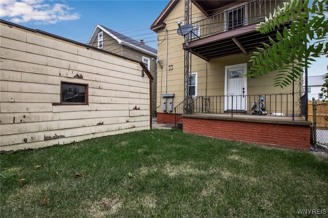 245 Tacoma Ave, Buffalo, NY 14216 - view of property exterior with a balcony and a lawn
