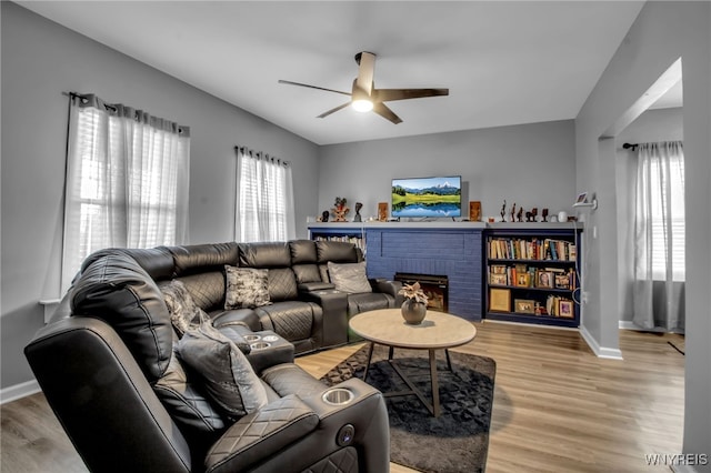 245 Tacoma Ave, Buffalo, NY 14216 - living area featuring ceiling fan, light wood-style flooring, and a fireplace