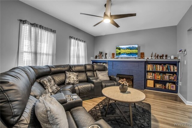 245 Tacoma Ave, Buffalo, NY 14216 - living room featuring a ceiling fan, wood finished floors, and a fireplace