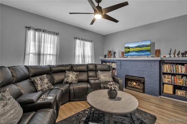 245 Tacoma Ave, Buffalo, NY 14216 - living room with a ceiling fan, wood finished floors, and a fireplace