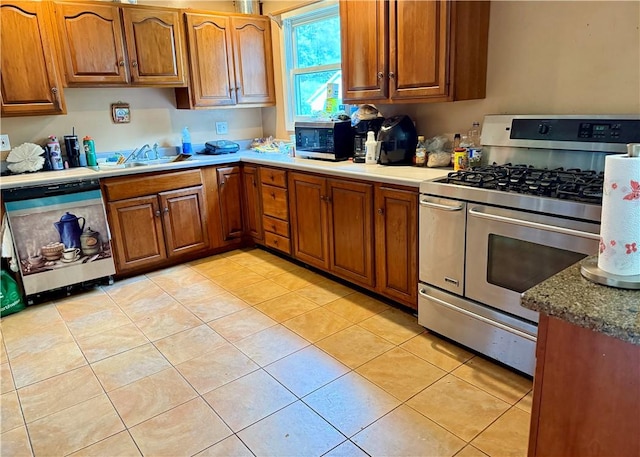 2 University Dr, Kirkland, NY 13323 - kitchen with stainless steel appliances, brown cabinetry, and light tile patterned floors