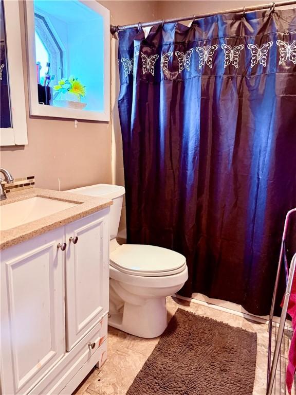 2 University Dr, Kirkland, NY 13323 - full bathroom with vanity and a shower with shower curtain
