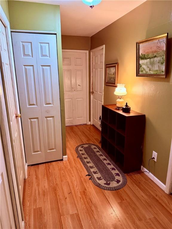 2 University Dr, Kirkland, NY 13323 - corridor featuring light wood-style flooring and baseboards