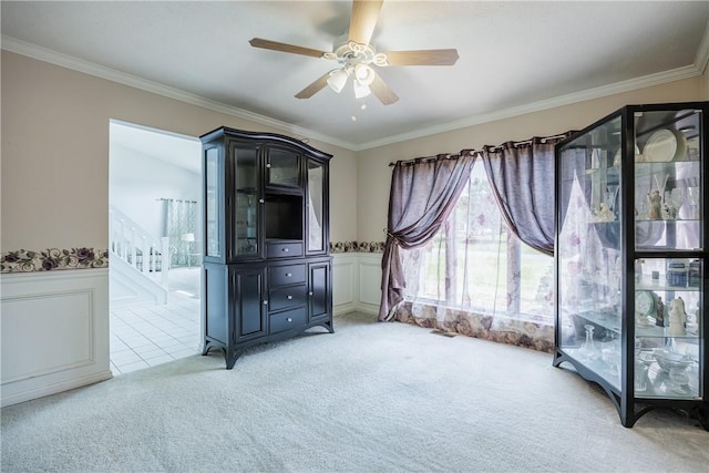 47 Edenfield Rd, Penfield, NY 14526 - bedroom featuring light carpet, crown molding, a wainscoted wall, and a ceiling fan