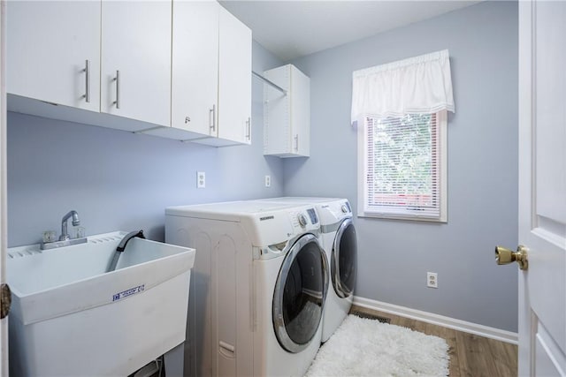 47 Edenfield Rd, Penfield, NY 14526 - laundry area featuring cabinet space, wood finished floors, and washer and clothes dryer