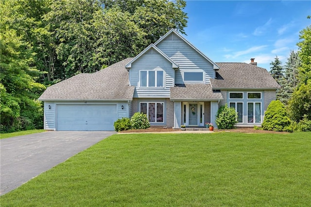 47 Edenfield Rd, Penfield, NY 14526 - view of front facade featuring asphalt driveway, a shingled roof, a front yard, and a garage
