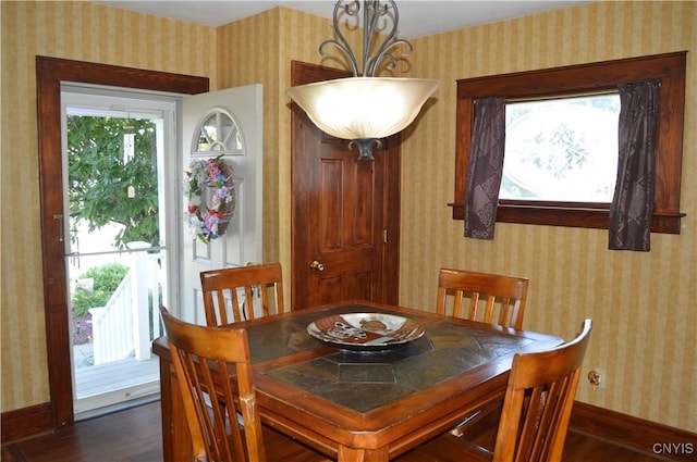 106 Mackay Ave, Camillus, NY 13219 - dining space with wallpapered walls and dark wood finished floors