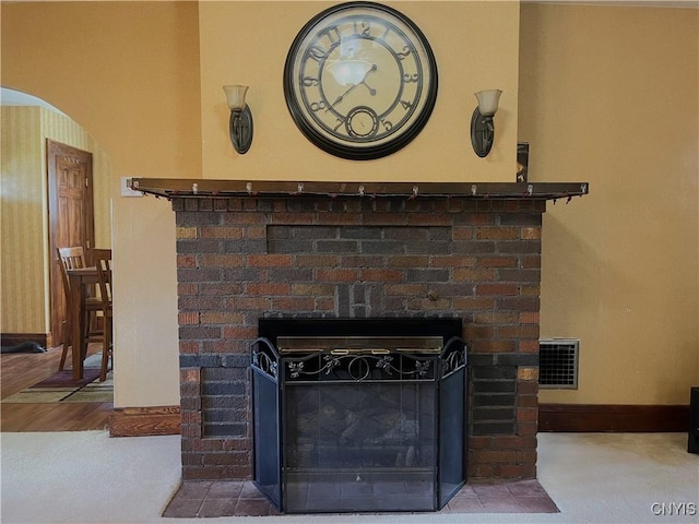 106 Mackay Ave, Camillus, NY 13219 - detailed view of arched walkways, a fireplace, and wood finished floors