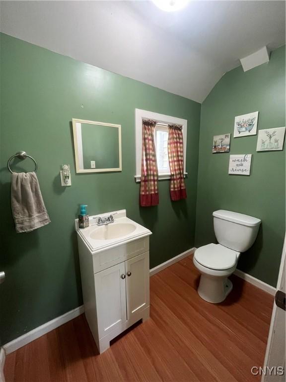 106 Mackay Ave, Camillus, NY 13219 - half bathroom with wood finished floors, vanity, and vaulted ceiling