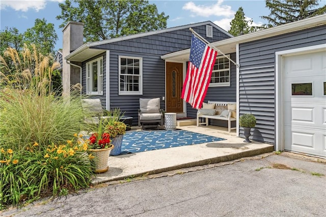 82 Rt 54 E Lake Rd, Milo, NY 14527 - entrance to property featuring a chimney, an outdoor living space, and a garage