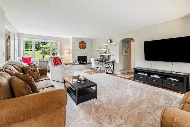 82 Rt 54 E Lake Rd, Milo, NY 14527 - living area featuring arched walkways and a fireplace