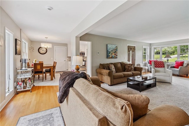 82 Rt 54 E Lake Rd, Milo, NY 14527 - living room with a chandelier and light wood finished floors