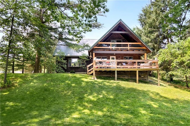 1677 Long Point Beach Rd, Torrey, NY 14527 - rear view of property featuring a deck, a lawn, log siding, and a metal roof