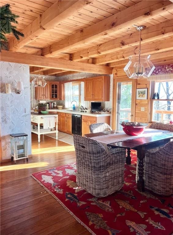 1677 Long Point Beach Rd, Torrey, NY 14527 - dining area featuring a chandelier, hardwood / wood-style floors, and a wood ceiling with exposed beams