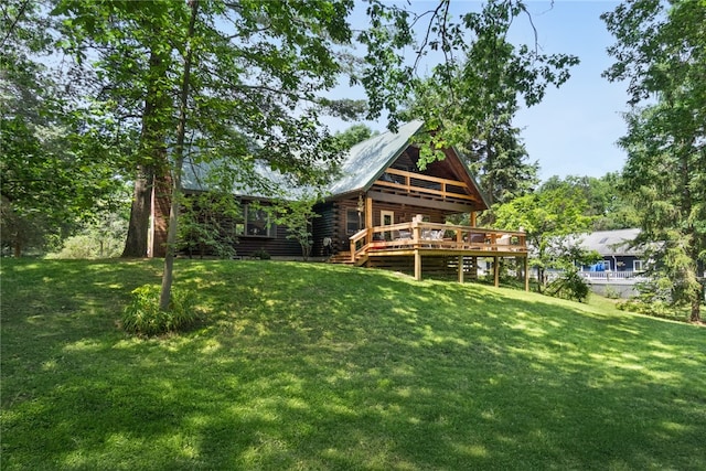 1677 Long Point Beach Rd, Torrey, NY 14527 - back of house with a deck, a lawn, and log siding