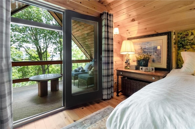 1677 Long Point Beach Rd, Torrey, NY 14527 - bedroom featuring wood finished floors and wooden walls