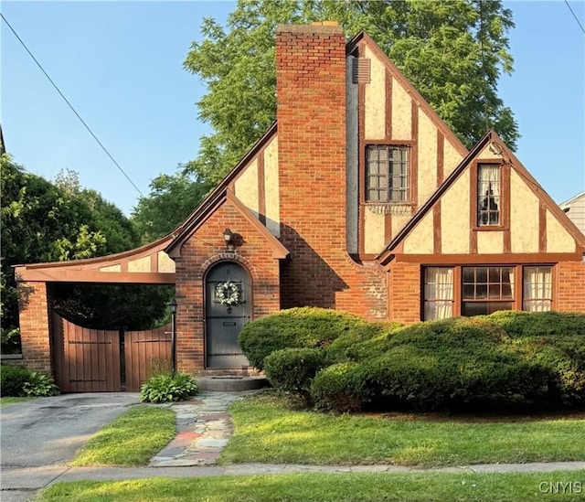11 Brookline Dr, Utica, NY 13501 - view of front of property featuring stucco siding, brick siding, and driveway