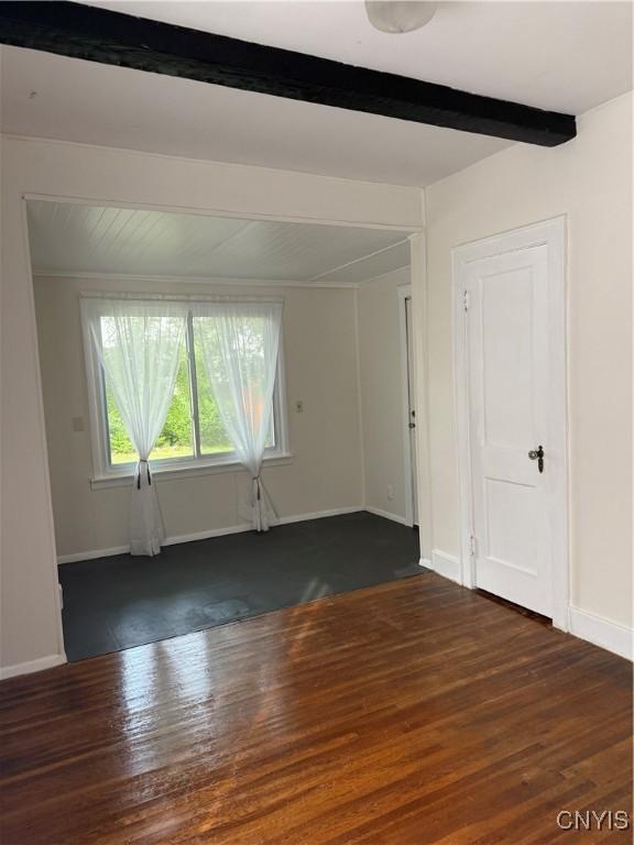 11 Brookline Dr, Utica, NY 13501 - empty room featuring beamed ceiling and wood finished floors