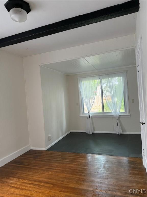 11 Brookline Dr, Utica, NY 13501 - spare room featuring beam ceiling, plenty of natural light, and wood finished floors