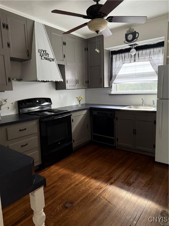 11 Brookline Dr, Utica, NY 13501 - kitchen featuring black appliances, dark wood-style flooring, dark countertops, ventilation hood, and ceiling fan