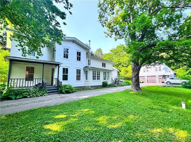1765 W Rd, Oneida, NY 13421 - view of front of home with a porch and a front lawn