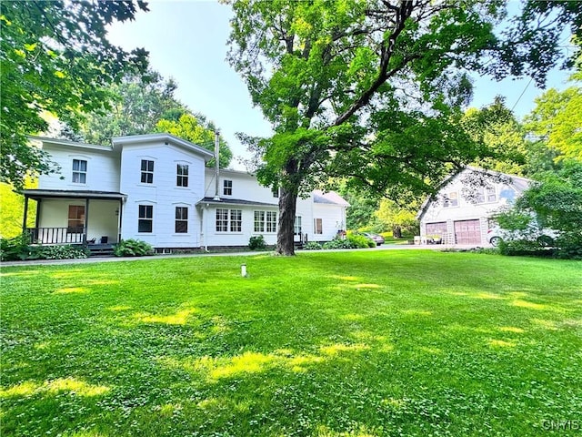 1765 W Rd, Oneida, NY 13421 - rear view of property featuring a yard and covered porch