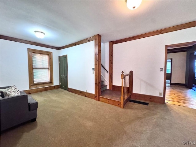 1765 W Rd, Oneida, NY 13421 - unfurnished living room with carpet floors and stairway