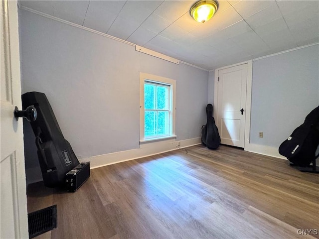 1765 W Rd, Oneida, NY 13421 - unfurnished bedroom featuring ornamental molding and wood finished floors