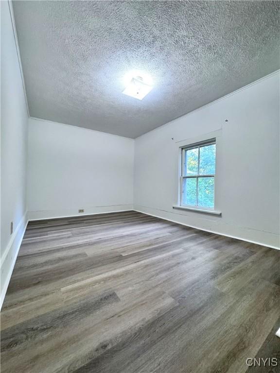 1765 W Rd, Oneida, NY 13421 - unfurnished room featuring a textured ceiling and wood finished floors
