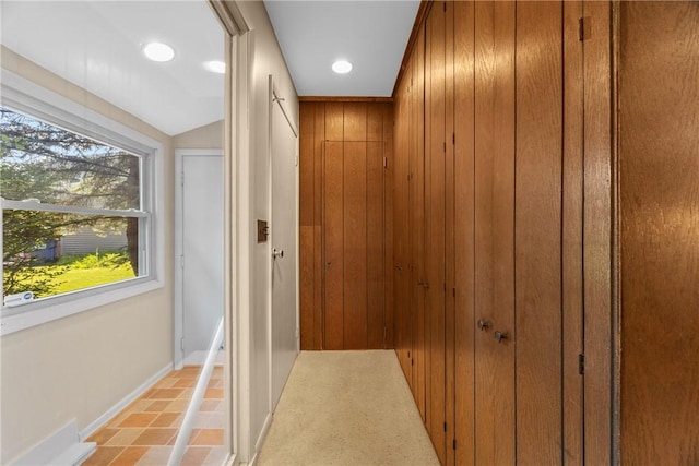 1077 Sharon Ct, Webster, NY 14580 - hall with wooden walls and recessed lighting