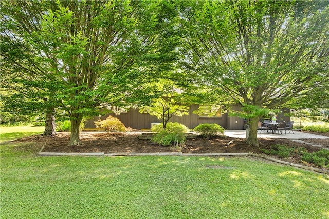 1077 Sharon Ct, Webster, NY 14580 - view of green lawn featuring a patio area