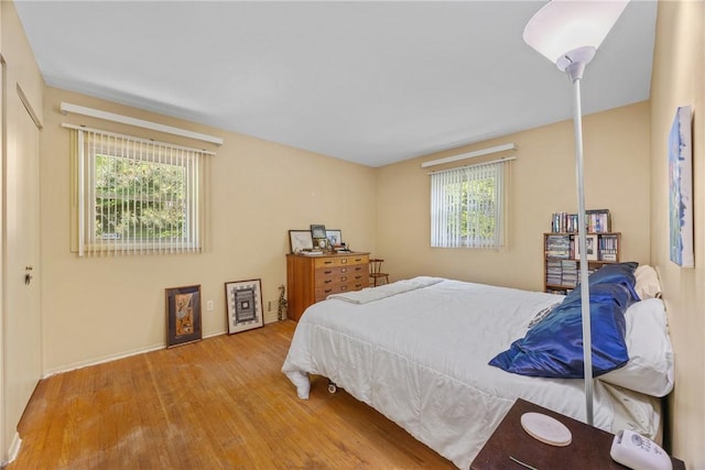 1077 Sharon Ct, Webster, NY 14580 - bedroom featuring wood finished floors and baseboards
