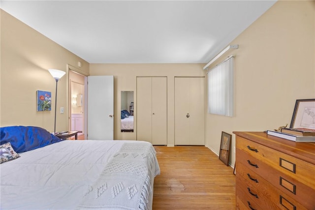 1077 Sharon Ct, Webster, NY 14580 - bedroom with two closets and light wood-type flooring