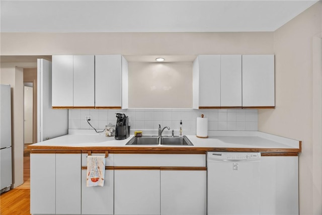 1077 Sharon Ct, Webster, NY 14580 - kitchen featuring white dishwasher, white cabinetry, and freestanding refrigerator