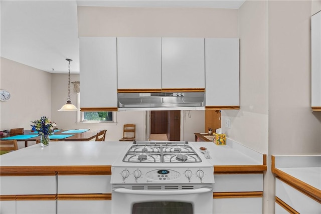 1077 Sharon Ct, Webster, NY 14580 - kitchen featuring white range with gas stovetop, under cabinet range hood, light countertops, and white cabinets