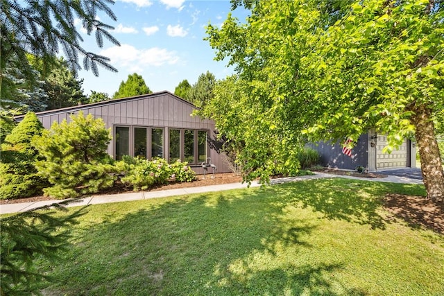 1077 Sharon Ct, Webster, NY 14580 - view of grassy yard with a garage