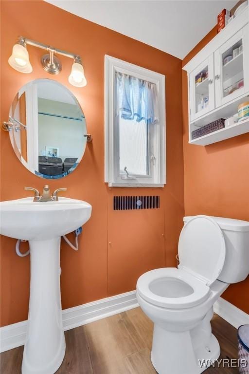 711 Colvin Blvd, Tonawanda, NY 14217 - bathroom featuring baseboards and wood finished floors