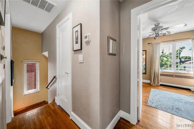 711 Colvin Blvd, Tonawanda, NY 14217 - hall with wood-type flooring and an upstairs landing