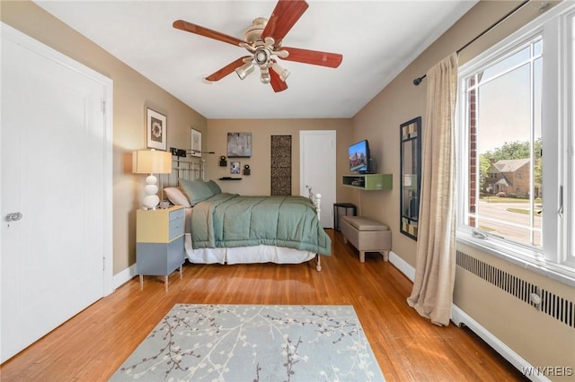 711 Colvin Blvd, Tonawanda, NY 14217 - bedroom featuring radiator, wood finished floors, and ceiling fan
