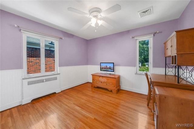 711 Colvin Blvd, Tonawanda, NY 14217 - office featuring radiator, wainscoting, light wood finished floors, and ceiling fan