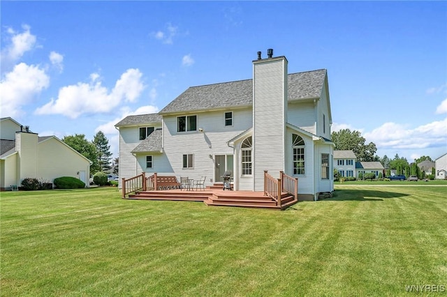 4584 Ridgeview Dr S, Pendleton, NY 14120 - rear view of house with a deck, a yard, and a chimney