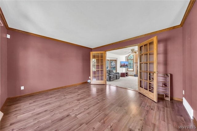 4584 Ridgeview Dr S, Pendleton, NY 14120 - spare room featuring french doors, ornamental molding, wood finished floors, and a ceiling fan