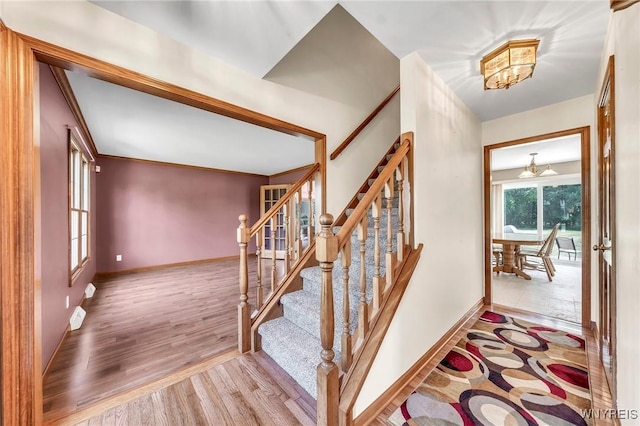 4584 Ridgeview Dr S, Pendleton, NY 14120 - entryway with wood finished floors, stairs, and ornamental molding