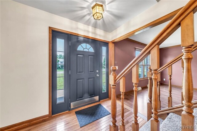 4584 Ridgeview Dr S, Pendleton, NY 14120 - entryway featuring plenty of natural light, wood-type flooring, and stairs
