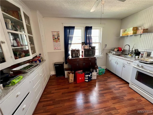 55 Harding Rd, Buffalo, NY 14220 - kitchen with white range oven, dark wood finished floors, a textured ceiling, black microwave, and light countertops