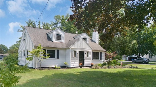 746 Dewitt Rd, Webster, NY 14580 - cape cod house with a chimney, a front lawn, and a shingled roof