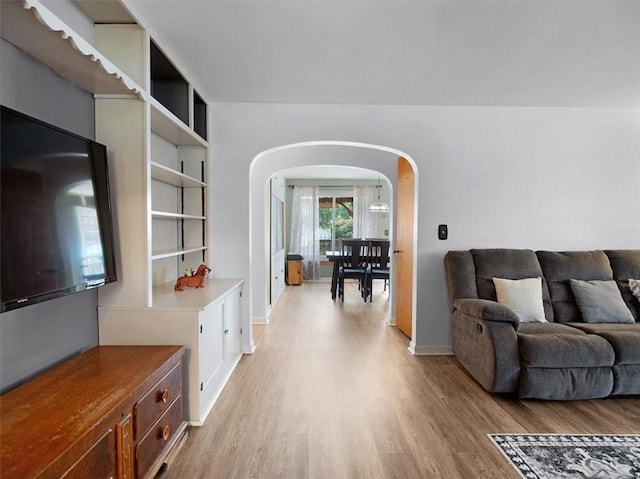 746 Dewitt Rd, Webster, NY 14580 - living area featuring arched walkways and light wood-style flooring